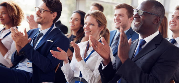 business people clapping at a conference 