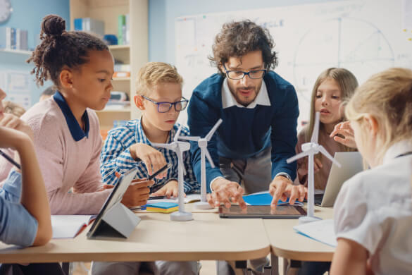 A teacher showing students a project